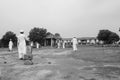 Men in traditional attire play cricket, Sarkhej Roza Royalty Free Stock Photo