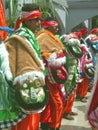 Men in traditional Indonesian costumes