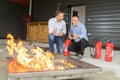 Men training with fire extinguishers Royalty Free Stock Photo