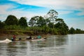 Men travel by canoe in the middle of the river Atrato Royalty Free Stock Photo