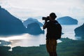 Men travel photography on the Mountain. Tourist on summer holiday vacation. Landscape Beautiful Mountain on sea at Samet Nangshe Royalty Free Stock Photo