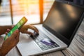 Men use smartphones to shop online. Businessmen transfer money via the Internet. A man`s hand holds a smartphone to payment. Royalty Free Stock Photo