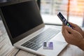 Men use smartphones to shop online. Businessmen transfer money via the Internet. A man`s hand holds a smartphone to payment. Royalty Free Stock Photo