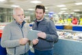 men using tablet in recycling plant Royalty Free Stock Photo
