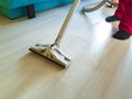Men vacuum the floor holding lifestyle action with steam homemaker