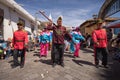 Men in various colourful costumes