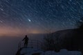 Men is on the viewpoint, under the startrail Royalty Free Stock Photo