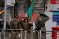 Men in vintage Irish Republican soldier uniforms salute