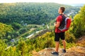 Men walk along the hill with backpack