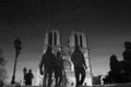 Men walk in front of Notre-Dame de Paris - CATHEDRAL - PARIS - CHURCH