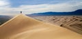 Men walking in the mongolian desert sand dunes. Young men walking golden sand on a bright summer day, Mongolia holliday