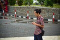 Men walking while seeing his smartphone