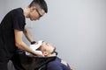 Men wash their hair in a barbershop, a guy makes a haircut in a beauty salon, comfort concept Royalty Free Stock Photo