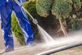 Men Washing Garden Paths Royalty Free Stock Photo