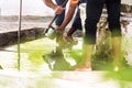 Men washing their feet making ablution on a fount in a mosque in Male, Maldives