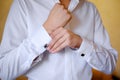 Men wear a cufflinks Royalty Free Stock Photo