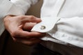 Men wear cufflinks Royalty Free Stock Photo