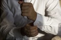 Men wear cufflinks on a shirt sleeve Royalty Free Stock Photo