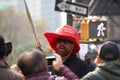 Men wearing large Make America Great Again Hat in NYC during Veterans Day Parade. Oversize MAGA Hat, red color standing out in
