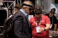 Men wearing Realmax virtual reality headsets