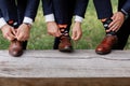 The men wears shoes with stylish socks. Stylish suitcase, men`s legs, multicolored socks and new shoes. Concept of style, fashion Royalty Free Stock Photo