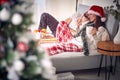 Men and  woman at Christmas morning texing mesage at bed Royalty Free Stock Photo