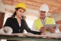 Female Architect and Foreman Meeting In Construction Site