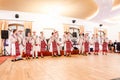 Men and women dancers performing Romanian folk dances