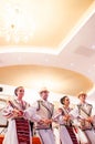 Men and women dancers performing Romanian folk dances