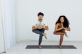 man and woman engage in yoga training aerobics stretching