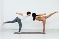 man and woman engage in yoga training aerobics stretching