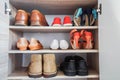 Men and women fashionable shoes in wardrobe Royalty Free Stock Photo