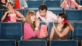 Men and Women Flirting in Theater Royalty Free Stock Photo