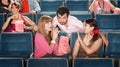 Men and Women Flirting in Theater