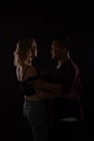 a man and a woman in love dance in a dark hall Royalty Free Stock Photo