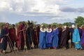 Men and women of Masai Tribe dancing and singing outdoors in traditional attire 12 16 2021 Arusha Tanzania