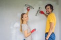 A man and a woman are plastering the walls of the house. DIY home renovation Royalty Free Stock Photo