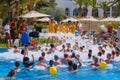 Men and women in the pool having fun at a foam party - Tunisia, Sousse, El Kantaoui 06 19 2019 Royalty Free Stock Photo