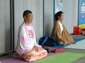 Men and women in the practice of Yoga
