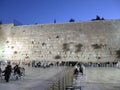Men and women pray at the wailing wall early in the morning in Jerusalem