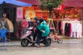 Men and women riding electric bicycles in the streets