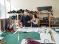 A man and a woman work as tanners in a workshop. Royalty Free Stock Photo