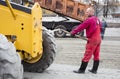 Men at work, asphalt laying. Road-building. Road construction machinery