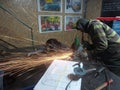 Men at work grinding steel Royalty Free Stock Photo