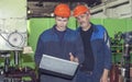 Men work on the old factory for the installation of equipment Royalty Free Stock Photo