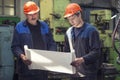 Men work on the old factory for the installation of equipment Royalty Free Stock Photo