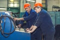 Men work on the old factory for the installation of equipment Royalty Free Stock Photo