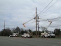 Men at work. PSEG workers replace power poles.
