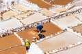 Men working at Beautiful Maras Salt Mines Peru South America