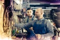 Men working at carshop